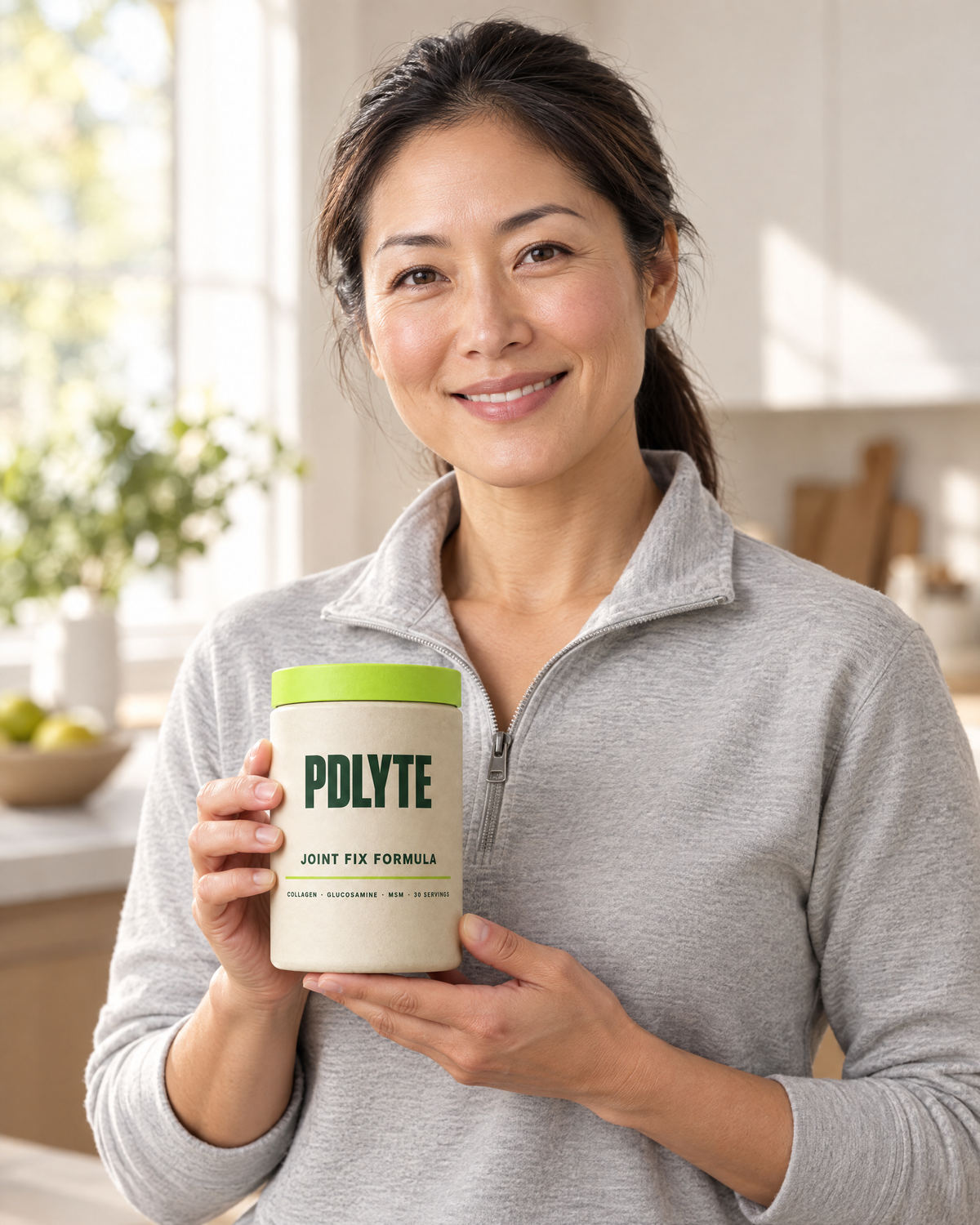 Customer holding a PDLYTE JOINT FIX FORMULA tub in her kitchen